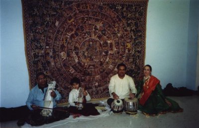 L to R: Pandit Ramesh Misra - sarangi, Rohan Misra - sarangi, Narendra Budhakar - tabla, Janaki Patrik - Kathak. Storytelling in front of kalamkari/cloth painting depicting the epic RAMAYANA L to R: Pandit Ramesh Misra - sarangi, Rohan Misra - sarangi, Narendra Budhakar - tabla, Janaki Patrik - Kathak. Storytelling in front of kalamkari/cloth painting depicting the epic RAMAYANA
