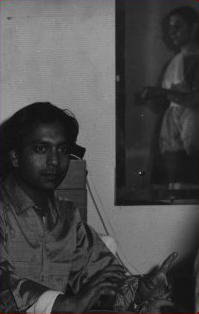Birju Maharaj playing tabla for Gina Lalli, reflected in mirror, New York City, 1963.  Photographer - Henry Levy